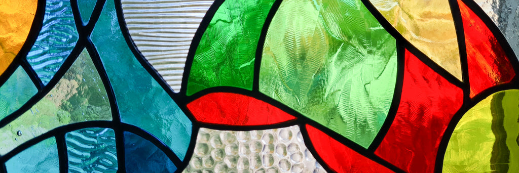Large stained glass window hanging, a custom-made unique glass panel of vase with monstera leaves