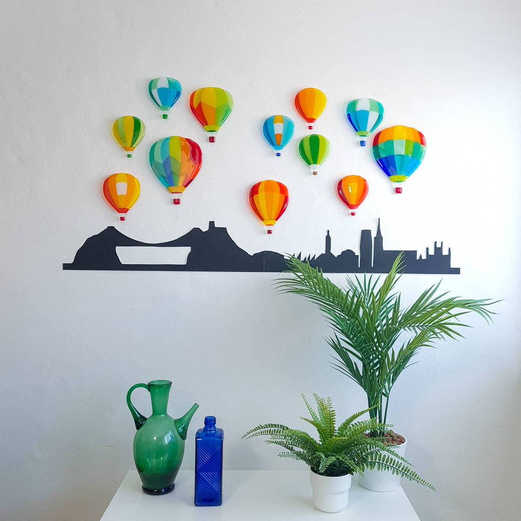 A collection of 12 fused glass hot air balloons by Glass Art by Linda. Unique designs in vivid colours in a Hard Edge glass art style